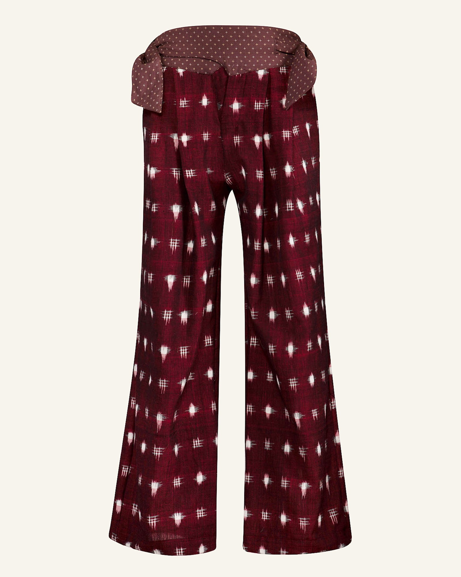 Cortina Bordeaux Ikat Pants showcasing a maroon and white checkered pattern with a wide, polka-dotted cotton waistband.