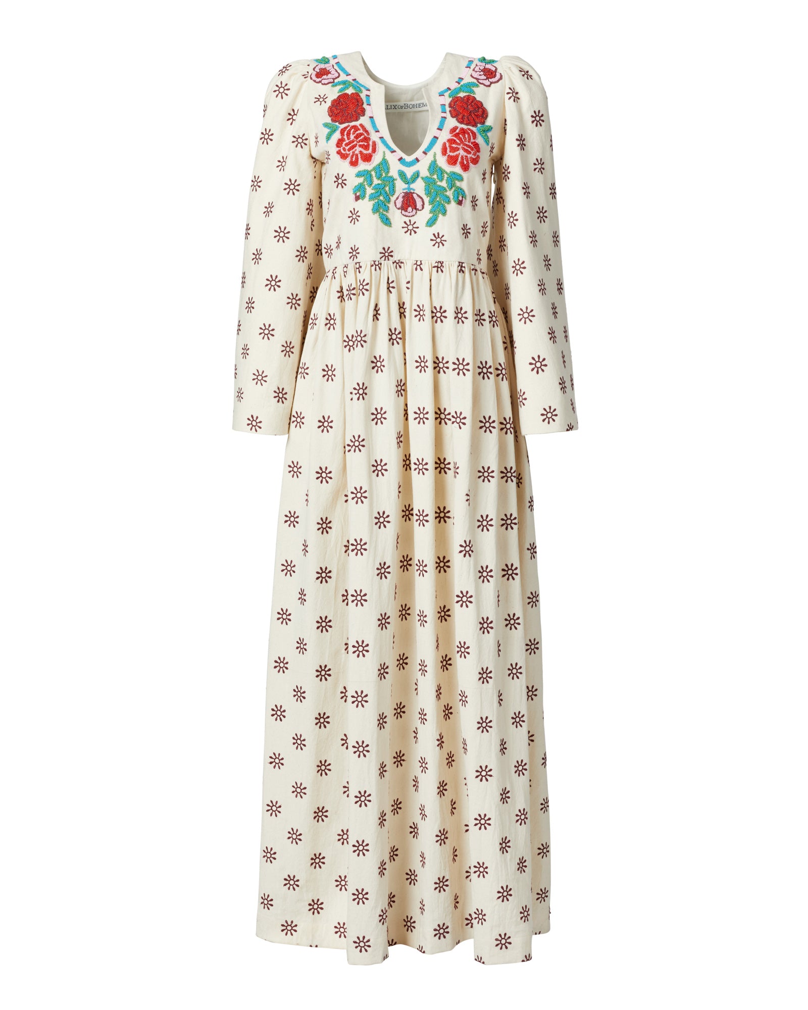 The Clementine Rambling Rose Dress is a silk dress with bell sleeves, showcasing a long-sleeved cream design adorned with red and blue floral embroidery on the neckline and accented by a pattern of small brown flowers throughout.