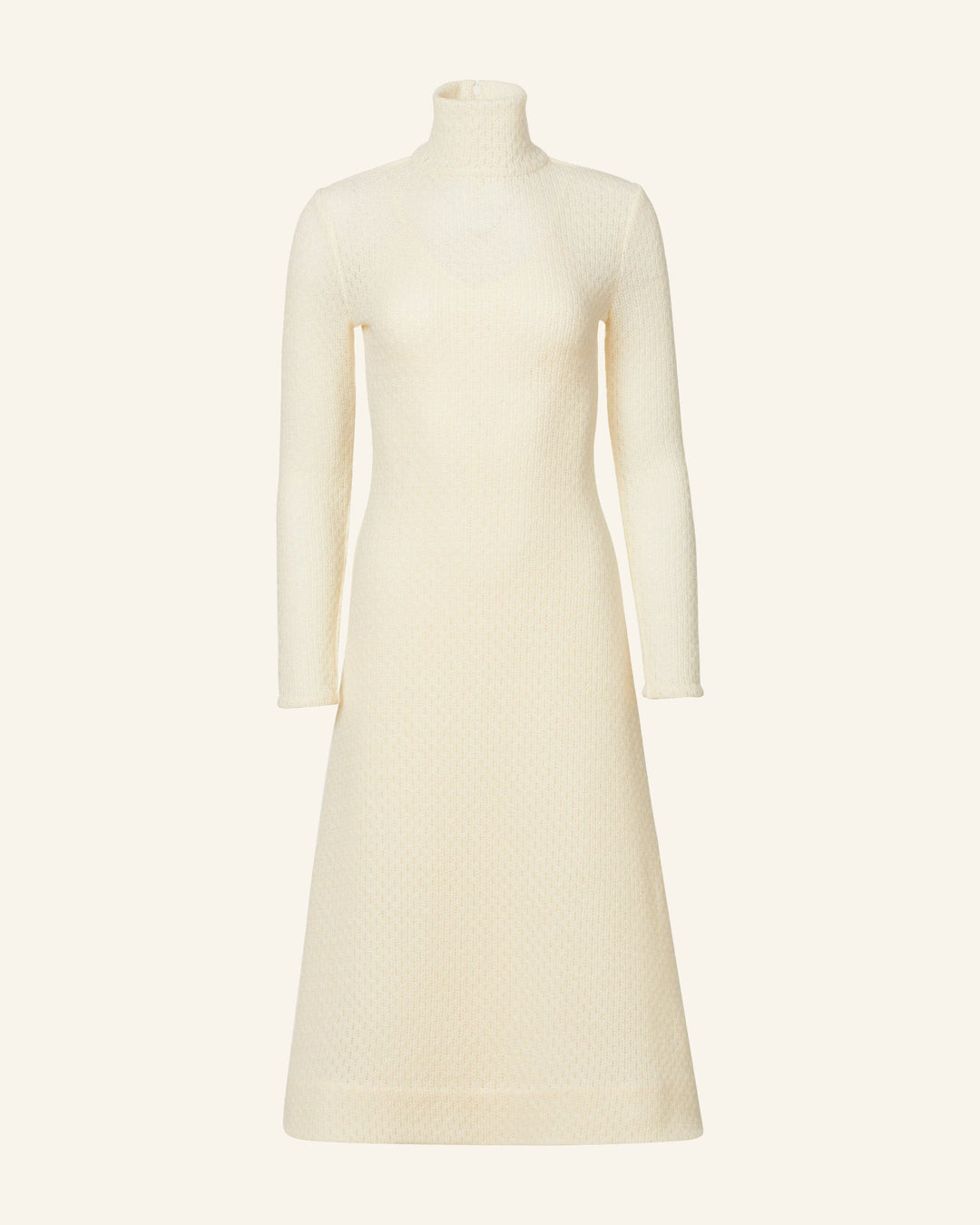 Introducing the Nona Marble Knit Dress, a long-sleeved cream-colored piece made from luxurious Italian wool. This dress showcases a high turtleneck collar and a subtle textured pattern, gracefully extending to a mid-calf length. With its fitted bodice and A-line skirt, it offers an elegant and minimalist silhouette.