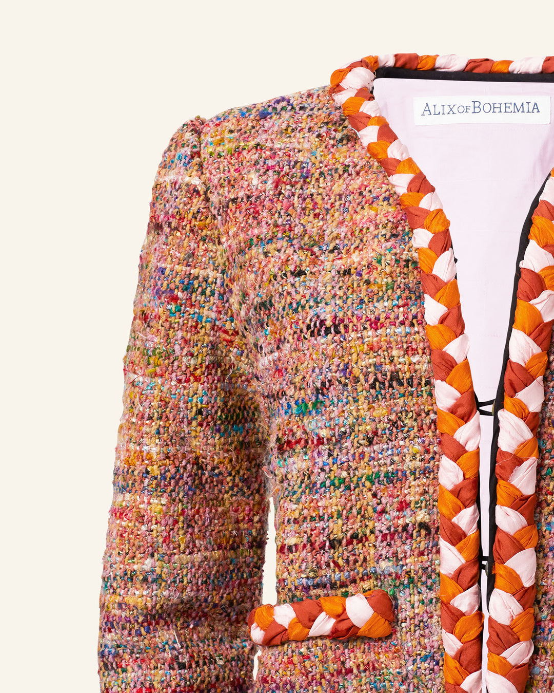 The Billie Rose Dust Boucle Jacket is a colorful tweed bouclé piece with multicolored woven trim, crafted from recycled fibers, and features a visible "Alix of Bohemia" label inside the collar.