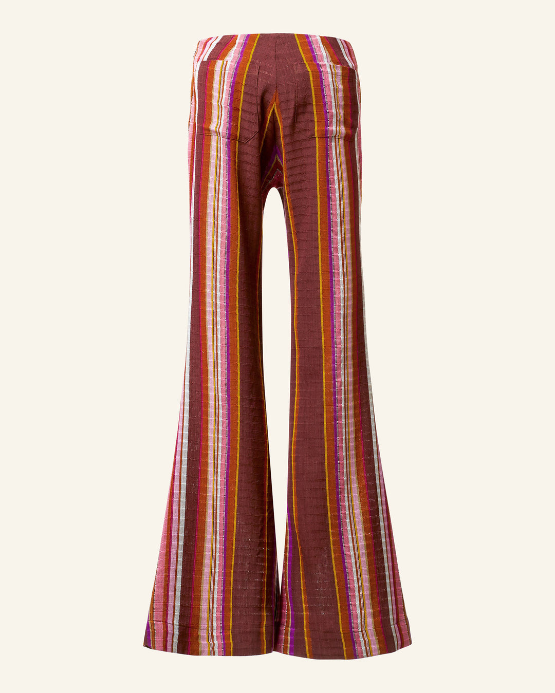 The Farah Berry Truffle Flare Pant showcases a bright and colorful vertical stripe pattern in red, orange, purple, and yellow hues against a beige backdrop. With its high waist and wide legs, this pant embodies a retro-inspired design typical of Bohemian styles.