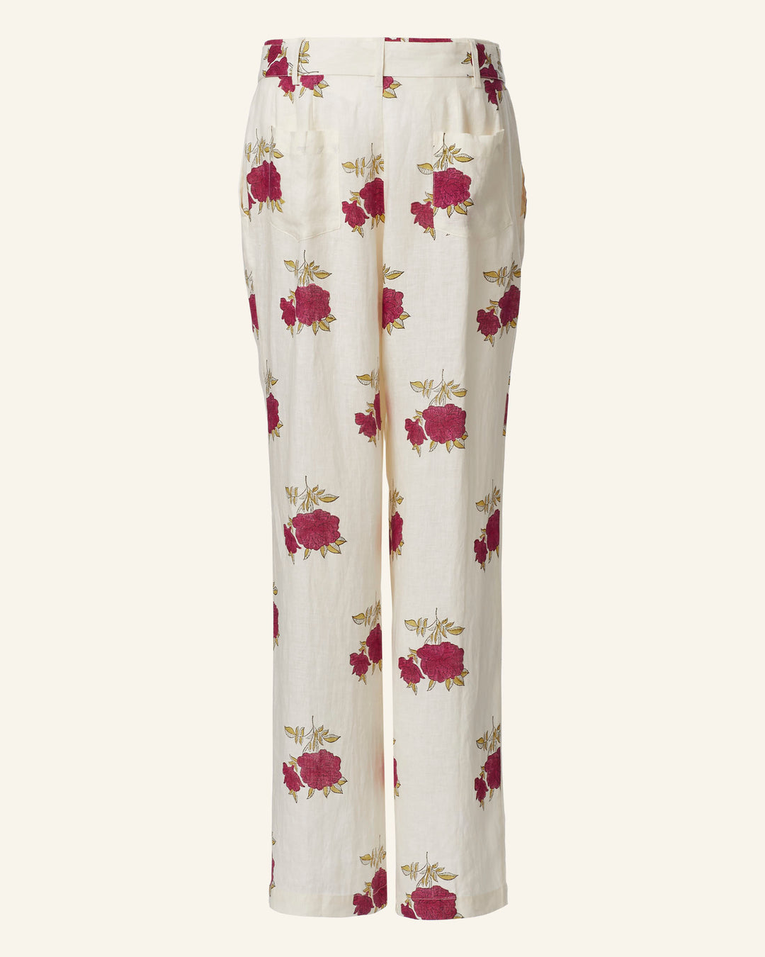 The Colette Cerise Rosette Pant is high-waisted and features straight legs, beautifully adorned with a charming hand-printed pink rose pattern on a cream background.