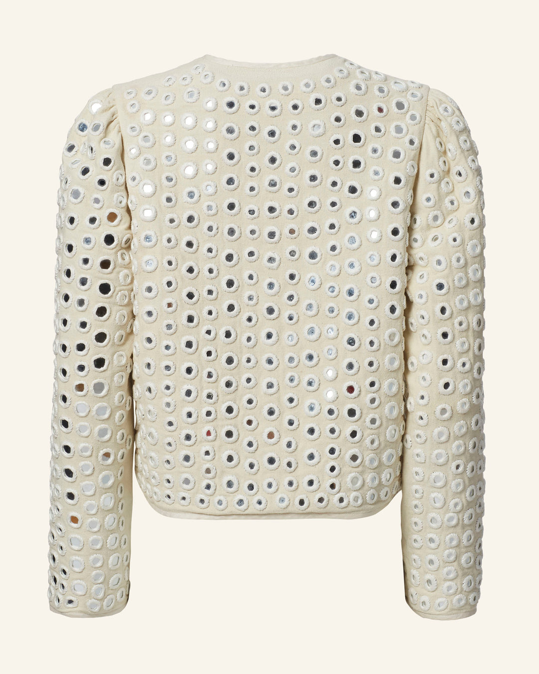 The Pasha Frosted Mirror Jacket is cream-colored with long sleeves, adorned with a design of circular metallic silver eyelets that evoke the look of hand-embroidered mirror work throughout its surface. This design creates a textured appearance, highlighted by closely arranged shiny loops. The jacket is showcased from the back.