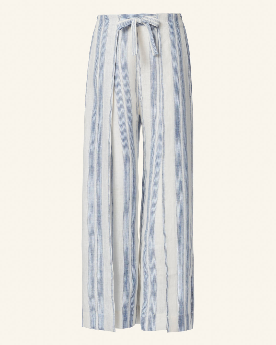 The Bonnie Pacific Wrap Pant showcases a vintage-inspired charm with its vertical blue and white stripes on wide-leg trousers. Designed with a high waist and secured with a tied belt, they effortlessly complement any modern wardrobe.