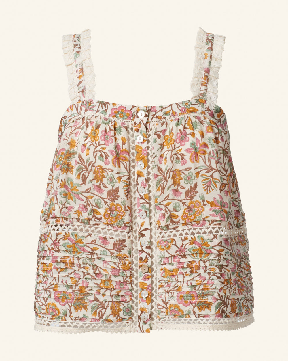 The Effie Garden Party Silk Top is a sleeveless, vintage-inspired piece adorned with intricate patterns and decorative buttons. It features lace detailing and a colorful design, showcasing hand-block printed orange, pink, yellow, and brown flowers against a light background.