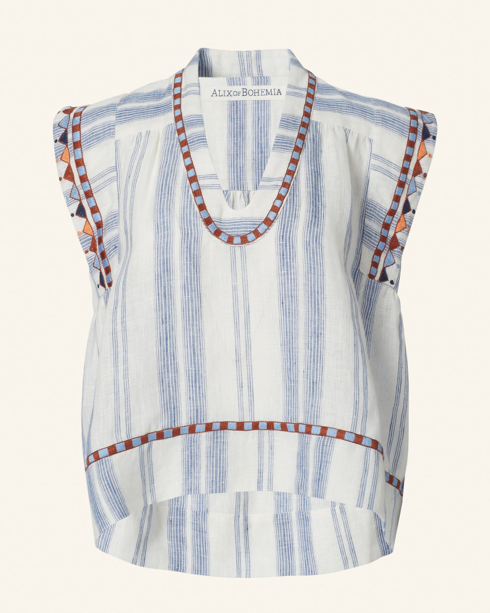 The Nehru Pacific Embroidered Top is a vintage-inspired silk sleeveless piece with vertical blue stripes and intricate geometric patterns in brown and blue adorning the neckline, sleeves, and hem. Hand-stitched silver coins enhance its distinctive design, while its relaxed, boxy fit features a v-neck style.