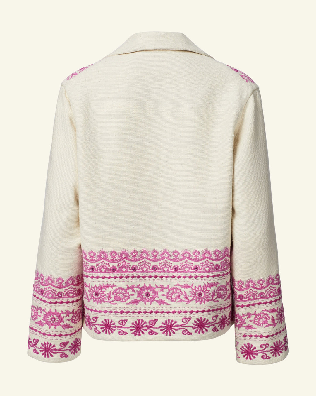 Introducing the Western Phlox Riviera Jacket: a cream-colored summer piece with a collar, adorned with intricate pink hand-embroidered floral and geometric patterns along the lower hem and cuffs. The back view highlights these detailed embellishments, making it an elegant addition to your warm-weather wardrobe.