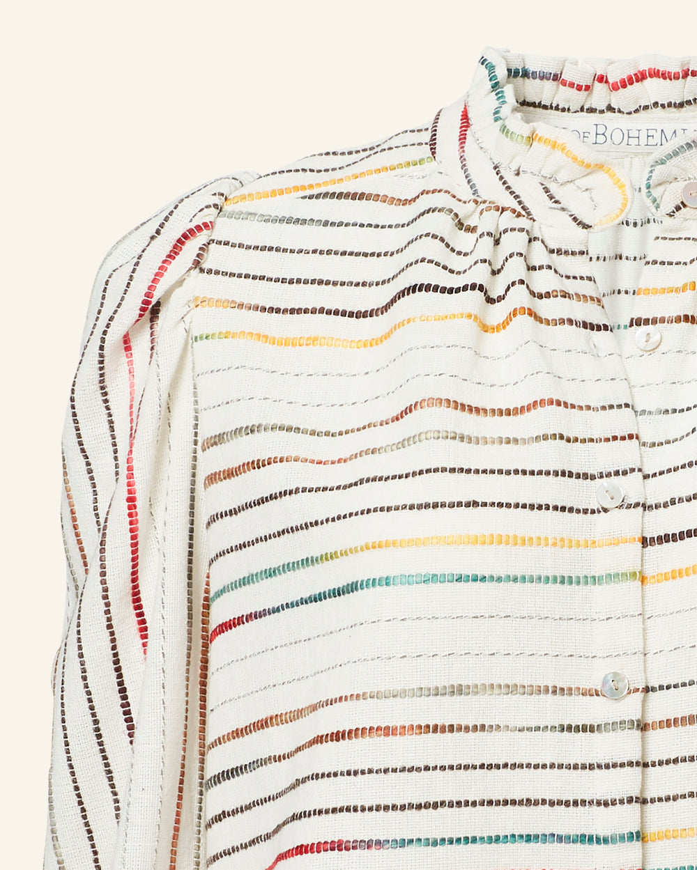 A close-up of the Annabel Chroma Weave Shirt, a white blouse adorned with colorful gradient vertical stripes and a high collar, crafted from hand-loomed cotton, featuring button details on the front.