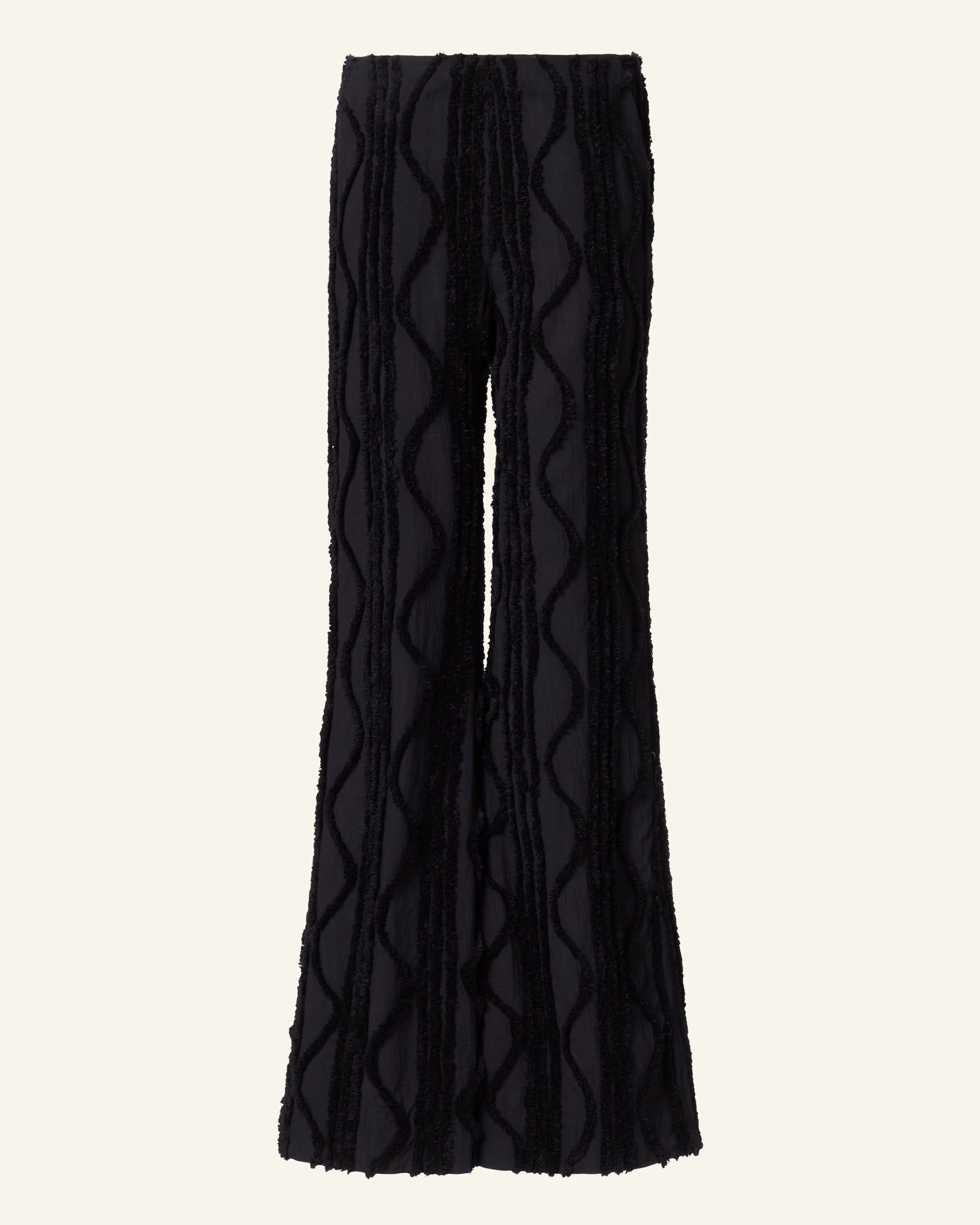 The Charlie Onyx Shag Pant, featuring a wavy textured pattern and full-length flared design, is displayed against a plain neutral background.