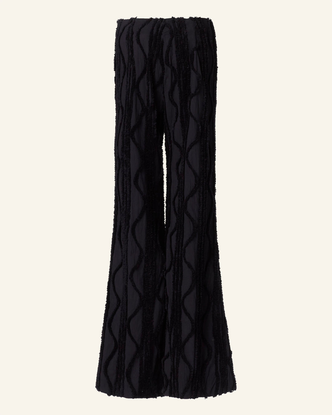 The Charlie Onyx Shag Pant features black textured evening wear with wavy vertical patterns and stylish shag-like details.