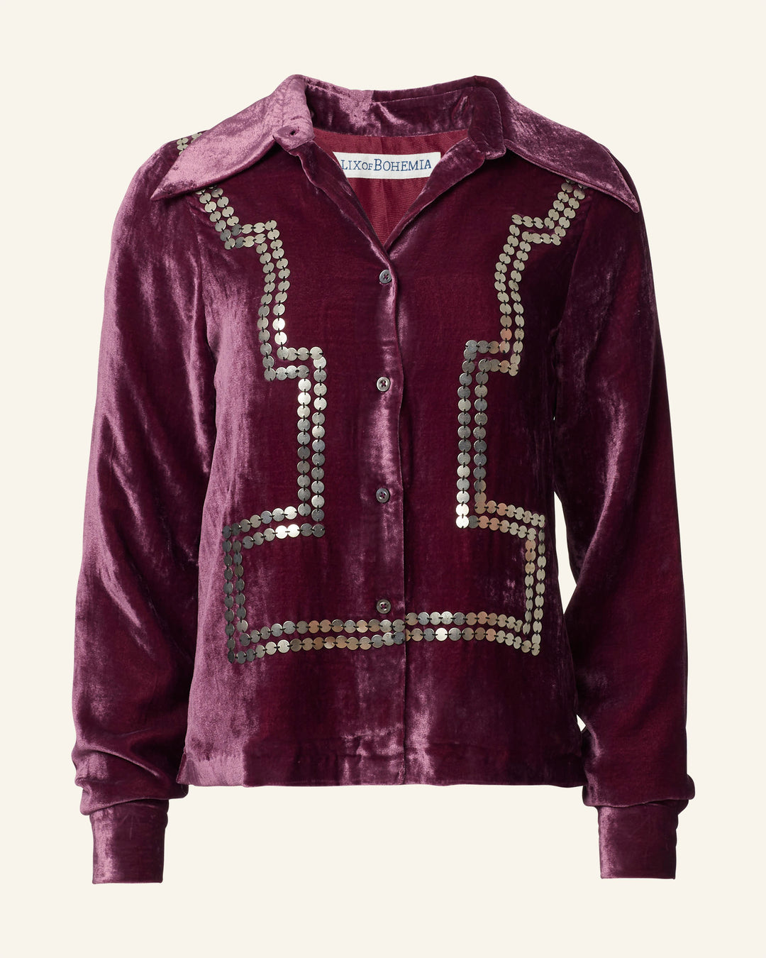 The Dolly Plum Velvet Shirt is a maroon velvet long-sleeve shirt with a vintage-inspired flair, featuring hand-embellished metallic sequins and a classic button-down front.