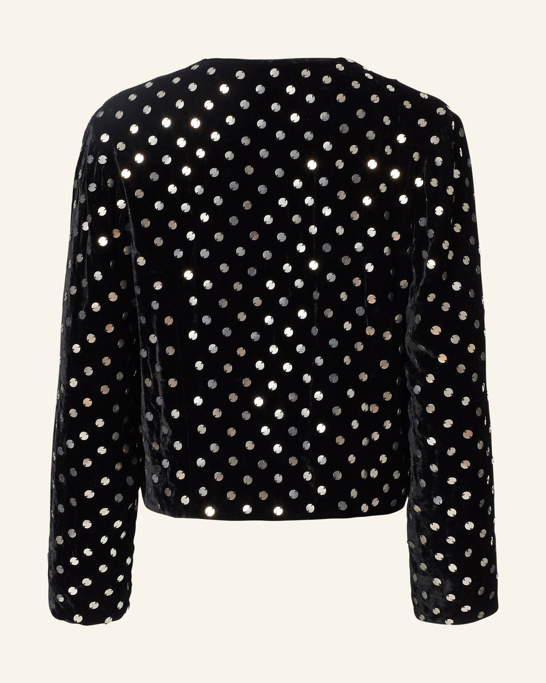 The Rowan Stardust Velvet Jacket is a sophisticated black evening piece featuring long sleeves and a dazzling pattern of silver polka dots. Displayed with elegance from the back on a light backdrop, this velvet creation effortlessly captures attention.