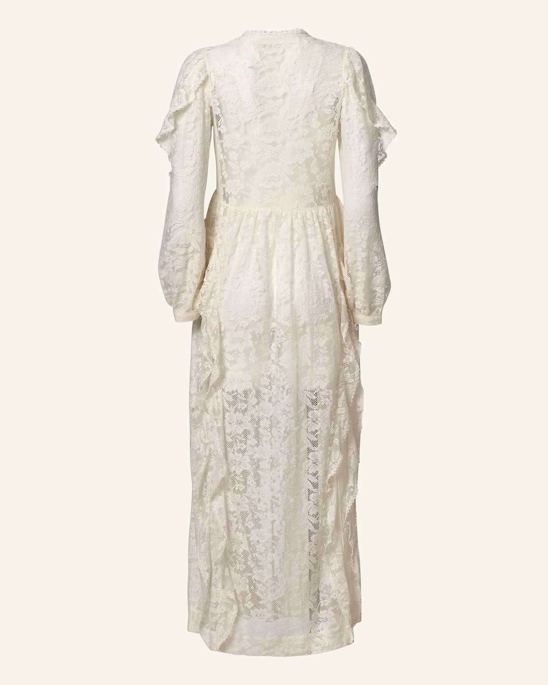 The Lina Magnolia Lace Dress is an ivory maxi dress with long sleeves, a high neckline, and ruffled shoulders. This vintage bridal gown features sheer lace and intricate floral patterns, elegantly captured from the back in the image.