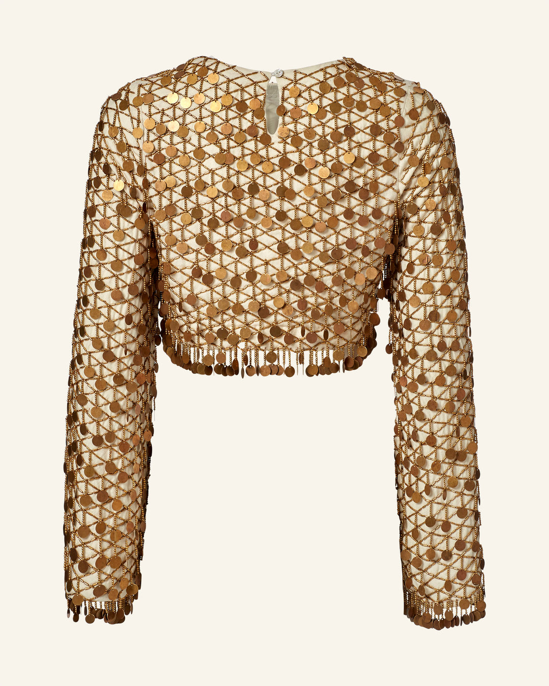 The Nina Whitegold Coin Top is a long-sleeve, sheer cropped top featuring hand-embellished gold circular sequins in a grid pattern.
