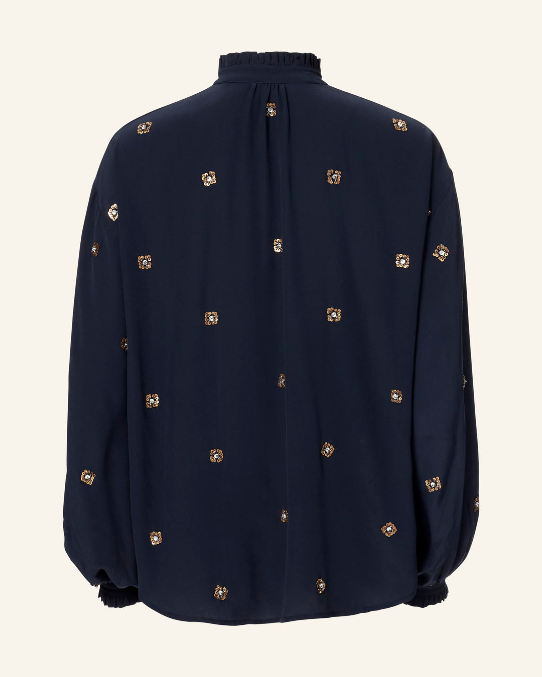 The image features the Poet Casino Night Blouse, a vintage-inspired black silk shirt with a high-neck collar and long sleeves. It has small gold square motifs, a loose fit, pleats at the back, and elastic cuffs for added charm.