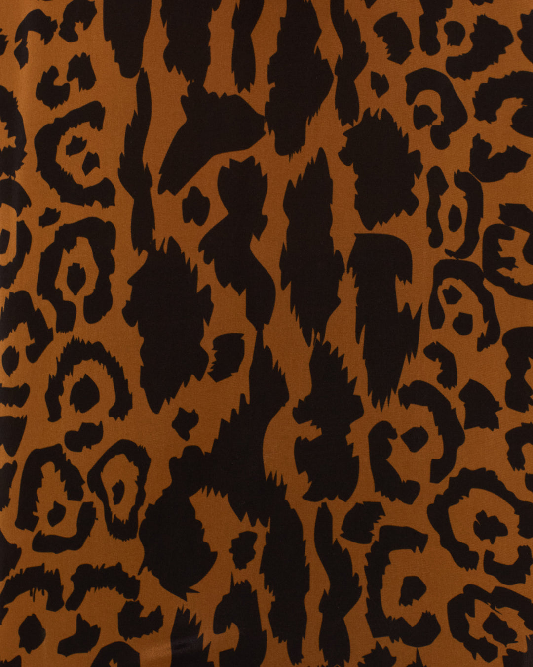 Close-up of brown silk crepe de chine with a black leopard print, featured in the Adelaide Leopard Silk Dress—perfect for a chic slip dress look.