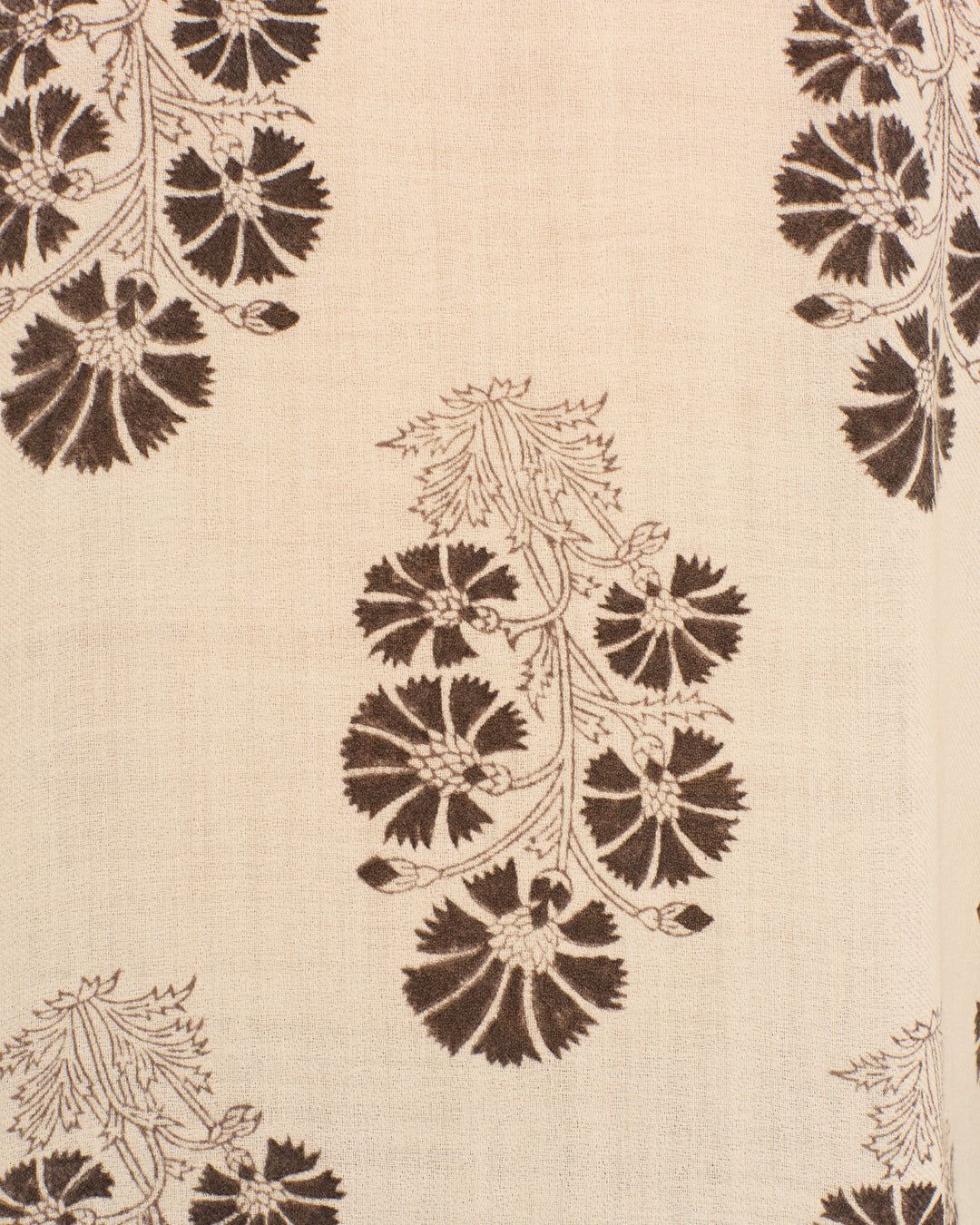 The Artemis Java Flower Shirt features beige fabric with a repeating brown floral pattern of stylized leaves and flowers in vertical rows, capturing the vintage-inspired charm of hand-block printing.