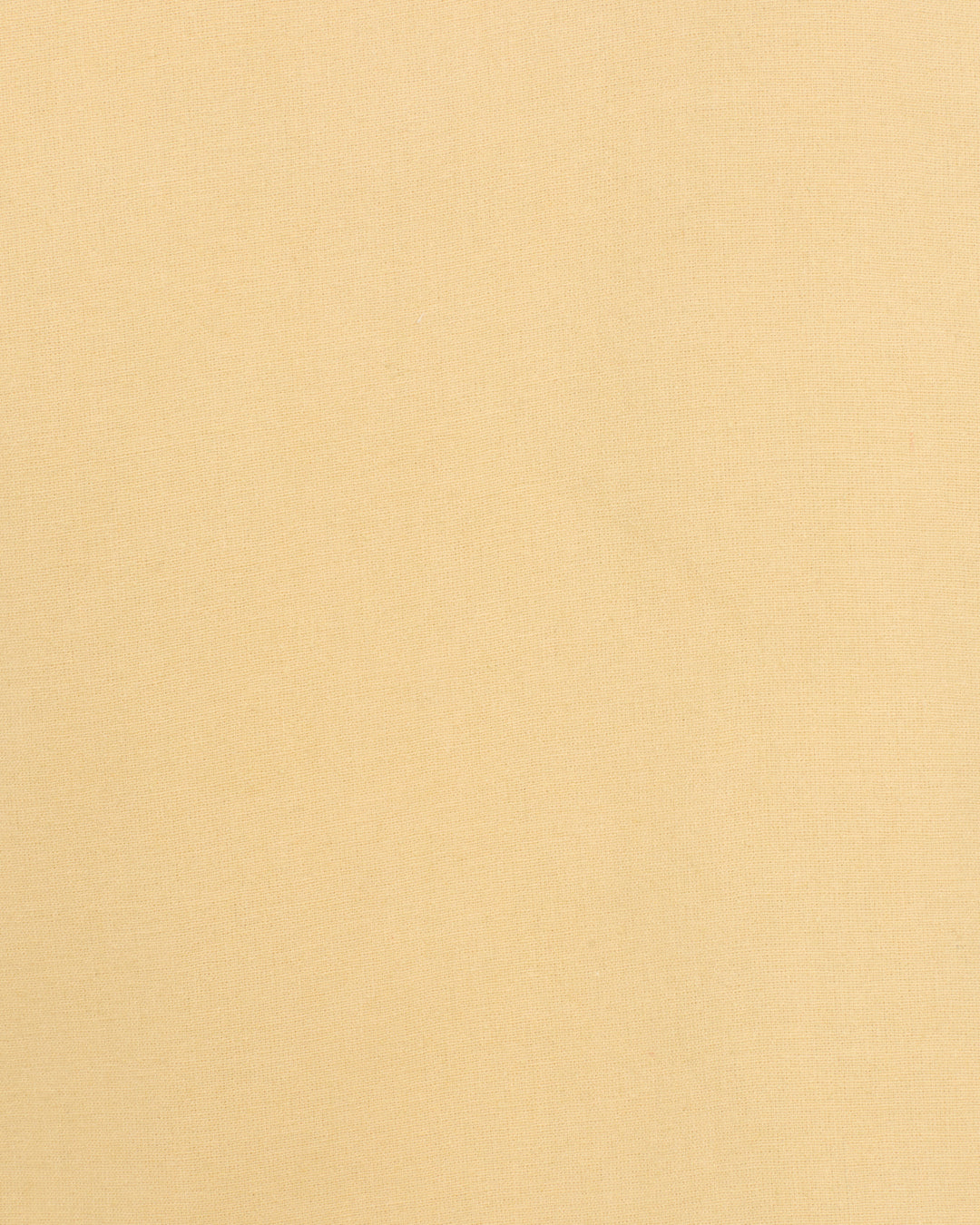 A close-up view of smooth, light beige fabric with an even texture, perfect for crafting the Francis Rye Tattoo Jacket—a refined cotton blazer with Western-inspired style.