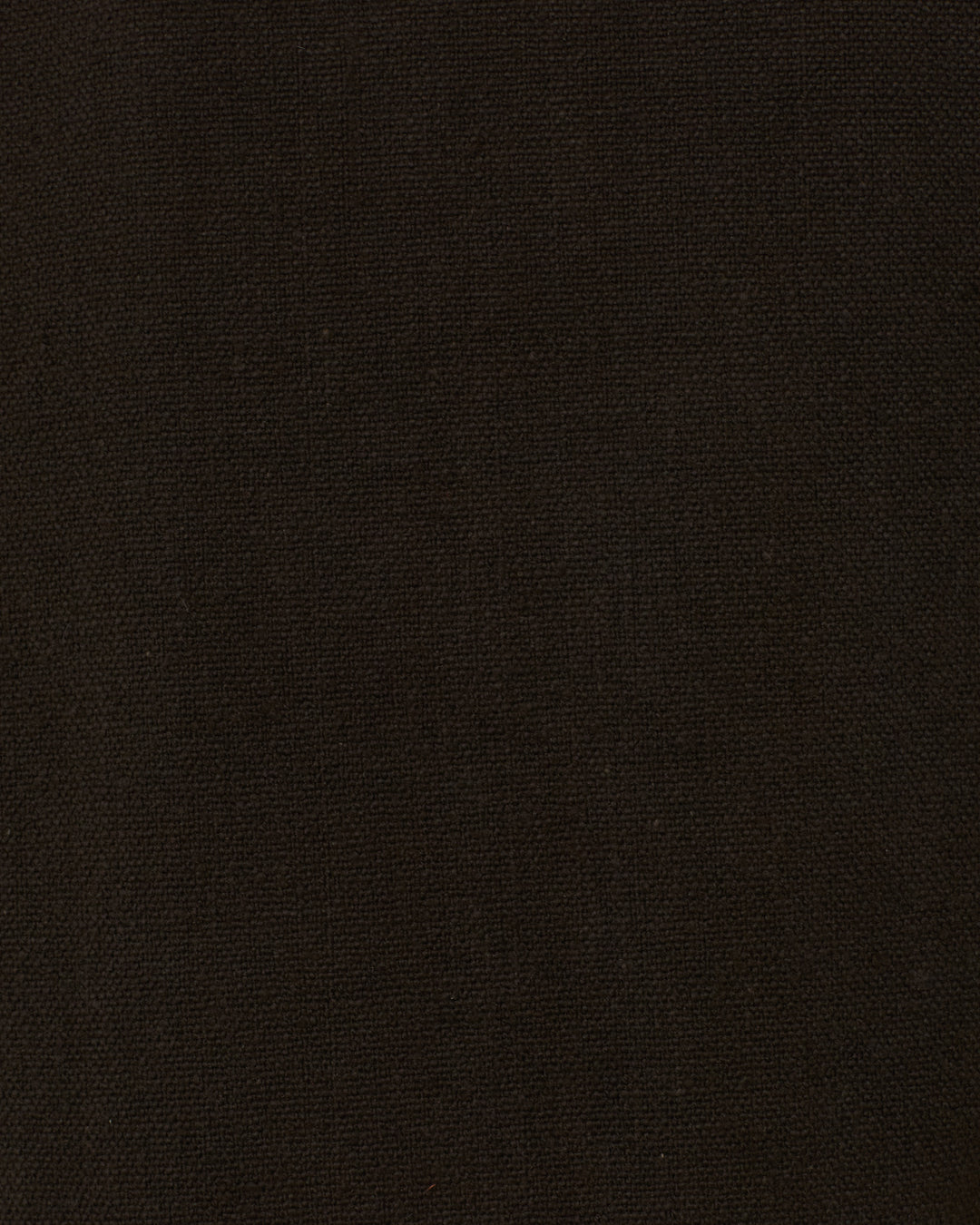 Close-up of the Francis Noir Tattoo Jacket’s dark brown, textured fabric surface with a subtle weave pattern, reminiscent of classic Khadi cotton.