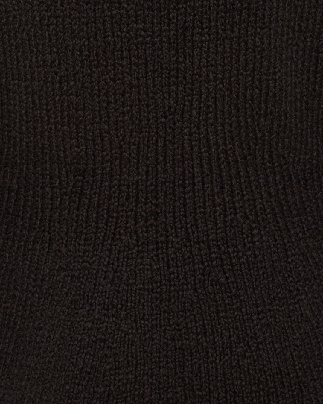 Close-up view of the textured, dark brown, ribbed knit fabric featured in the Renny Cow Skull Dress.