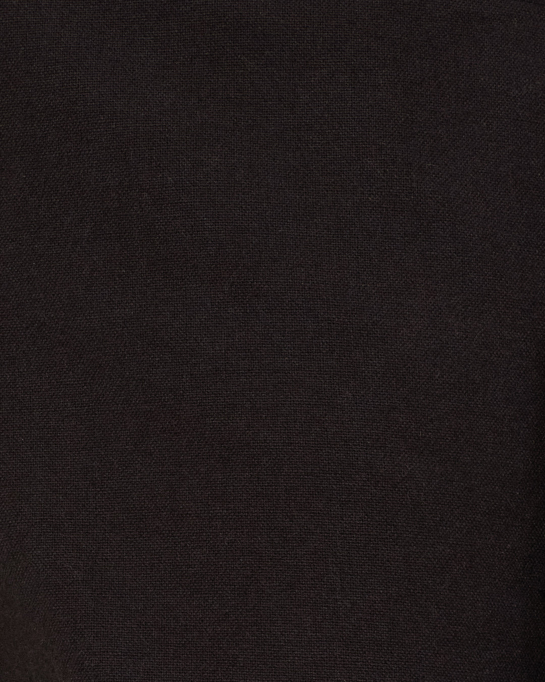 Close-up view of the Bunny Onyx Fringe Pant’s black fabric, featuring a slightly textured surface reminiscent of a jean-cut pant in a Western-inspired style.