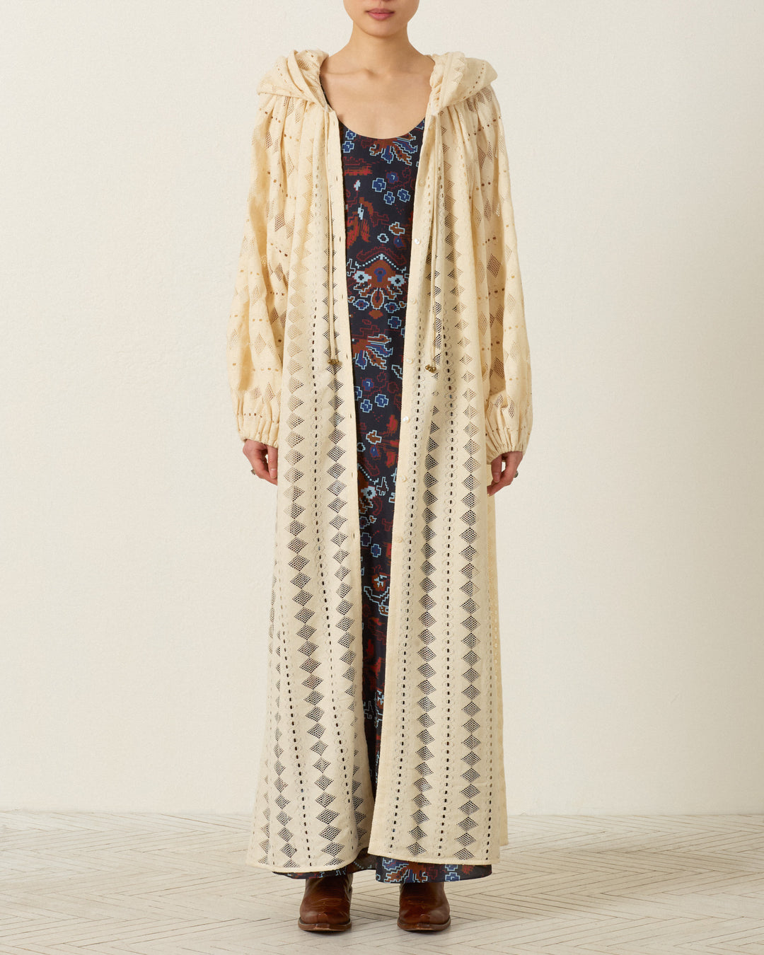 A person wearing the Marcie Savanna Lattice Dress stands against a plain background.