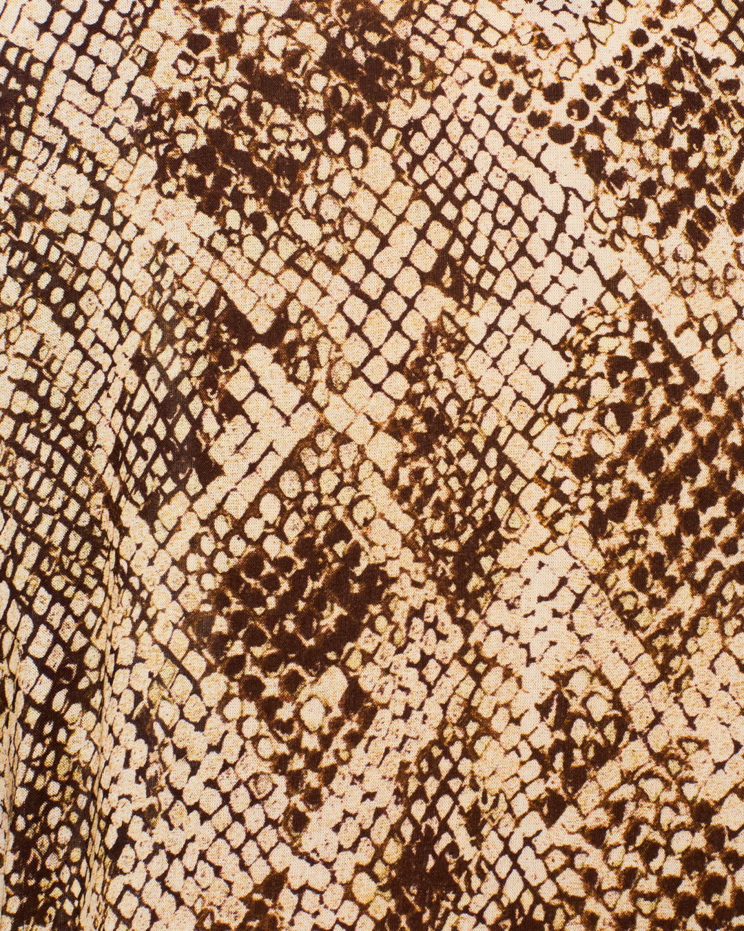 Close-up of the silky modal fabric of the Miles Lemon Snakeskin Jumpsuit, featuring a brown and beige snakeskin pattern with irregular diamond shapes and textured, scale-like details.