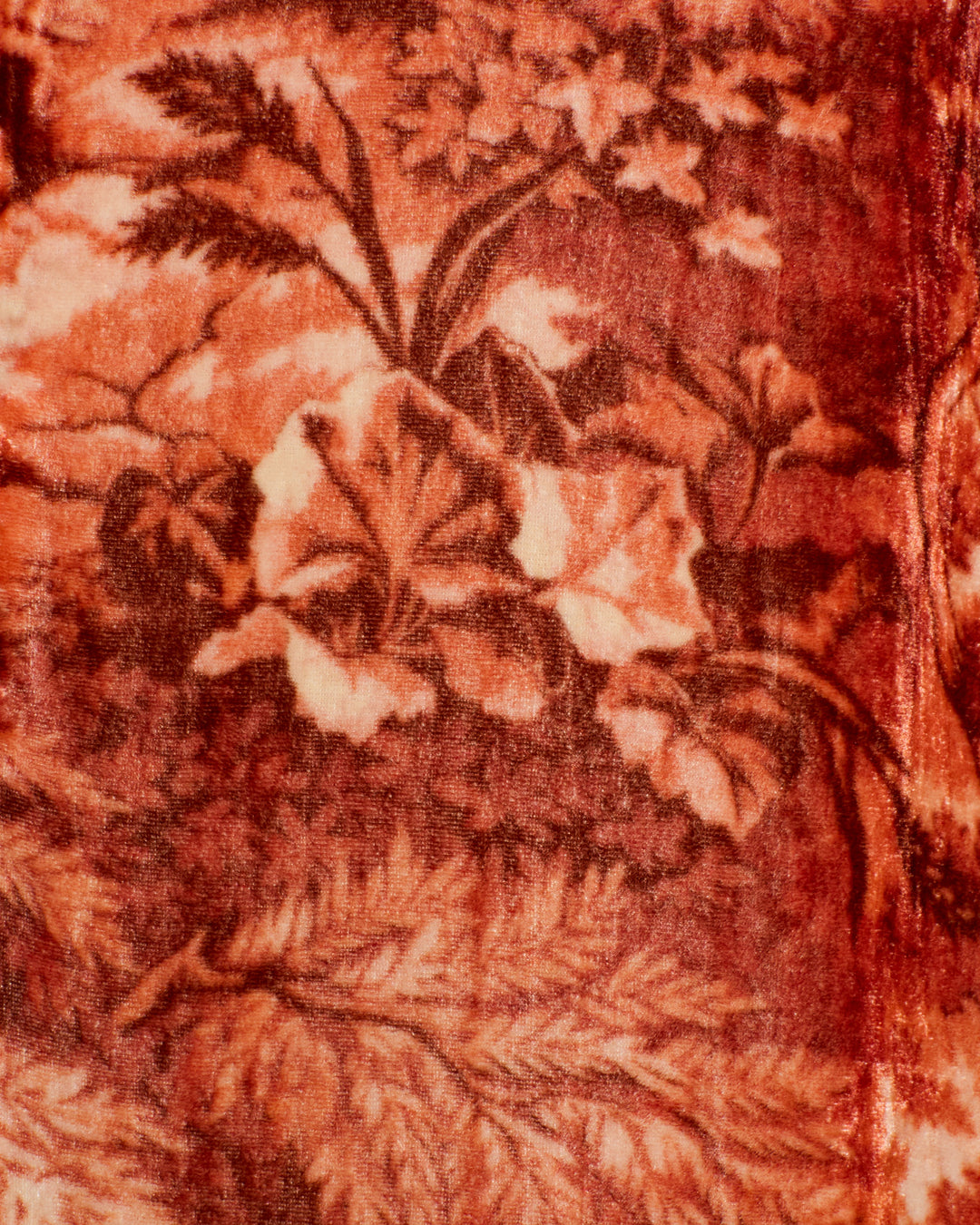 The Nadia Heritage Canopy Dress showcases a brown and cream floral pattern on a textured viscose-silk blend, featuring large leaves and flowers with a soft, velvety appearance.