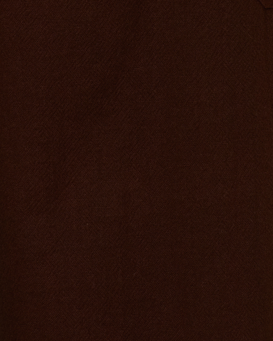 A close-up view of a dark brown textured surface, possibly fabric or leather, with subtle creases and a faint diagonal seam in the upper right corner—evoking the rugged appeal of the Painter Woodland Pant, featuring wide-leg styling and adjustable side tabs.