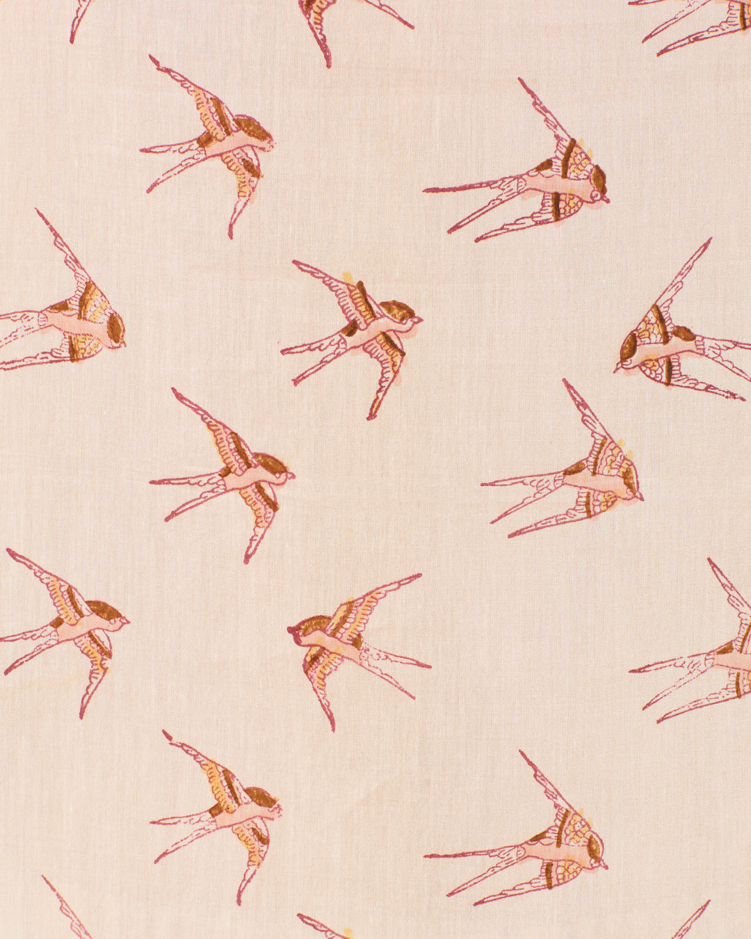 The Annabel Cedar Swallow Shirt features a beige cotton-silk blend hand-block-printed with illustrated swallows in brown and red, each flying in different directions across the fabric.