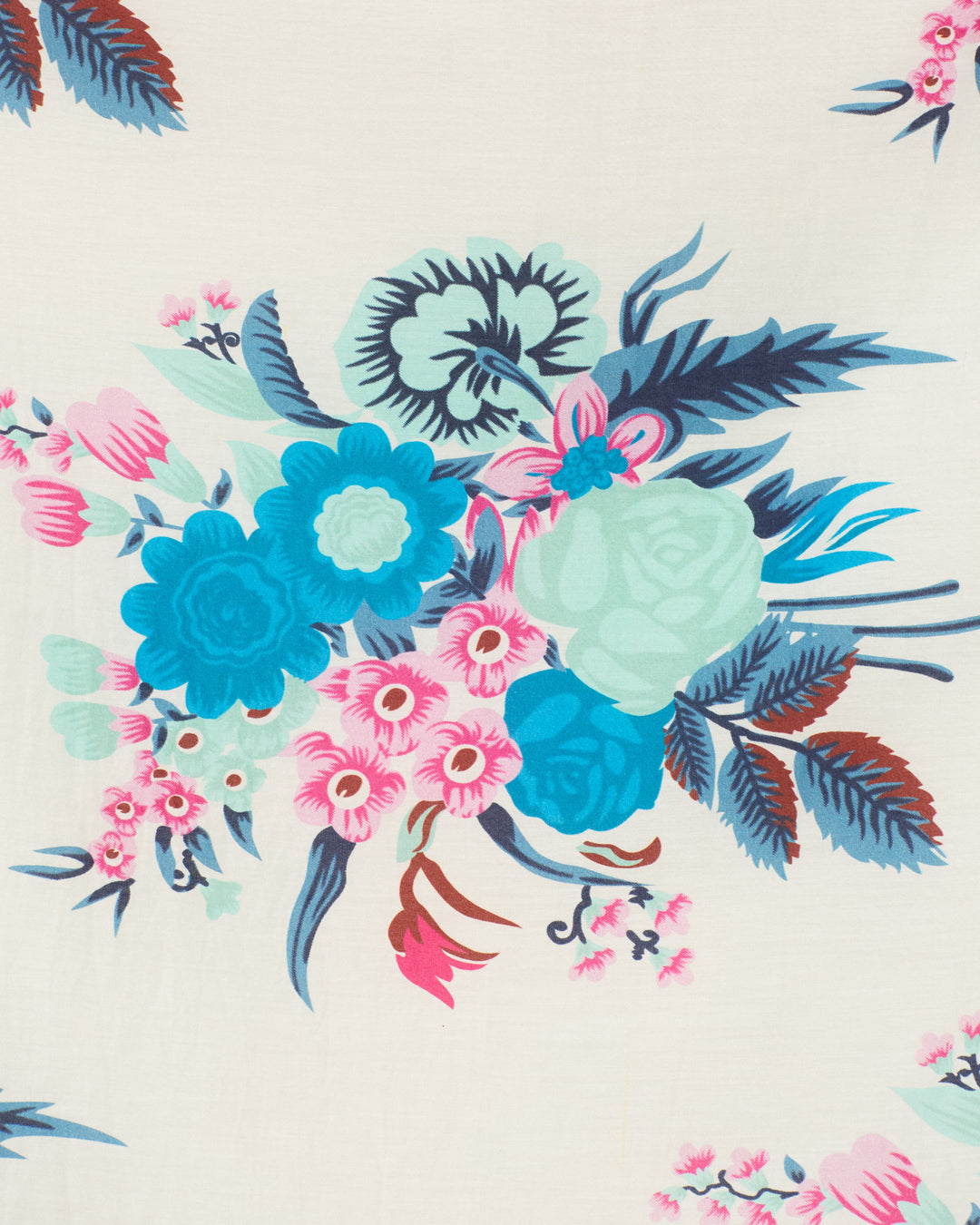 The Poet Juneberry Blouse features a vintage-inspired design with blue, teal, and pink floral clusters and dark green and red leaves, crafted from a soft cotton-silk blend.