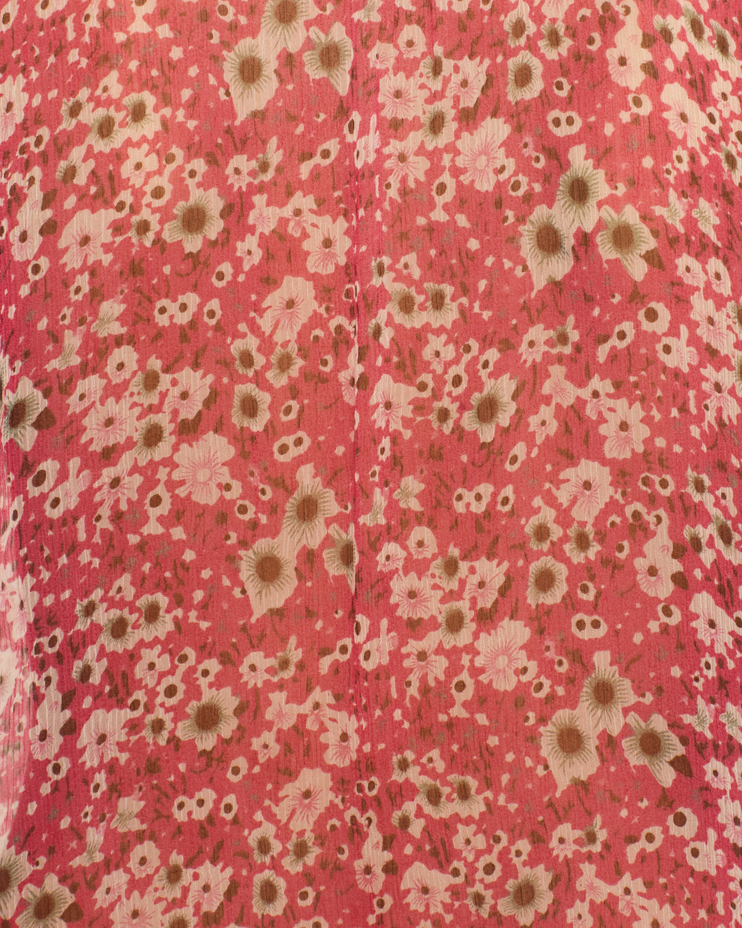Close-up of pink fabric from the Annabel Berry Cosmos Shirt, showing small beige and white flowers and a visible vertical seam.