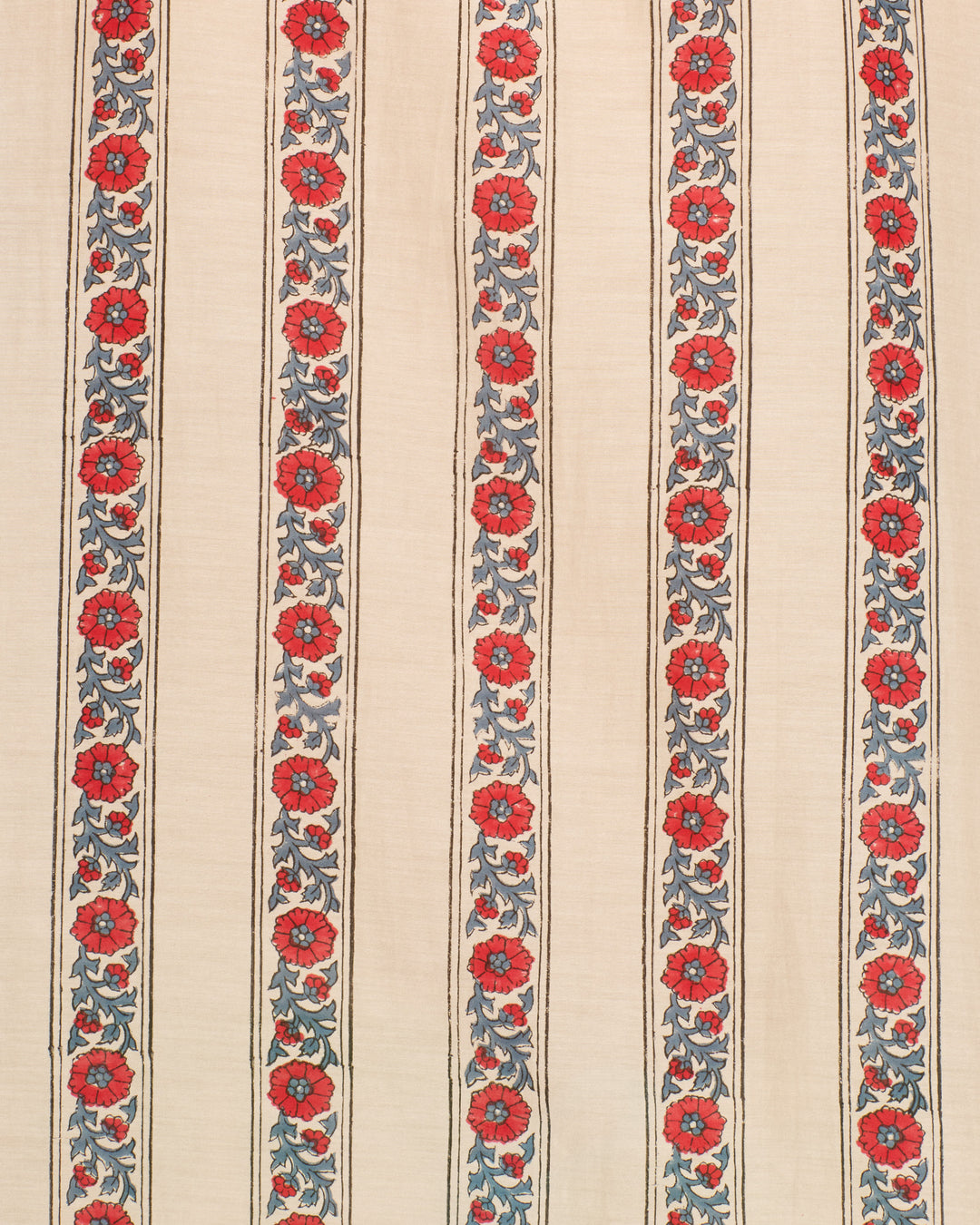 The Annabel Roseband Stripe Shirt showcases vertical beige fabric adorned with parallel red floral and blue-green vine motifs, hand-block-printed in a uniform repeat across its cotton-silk blend, and is finished with a charming ruffled collar for added elegance.