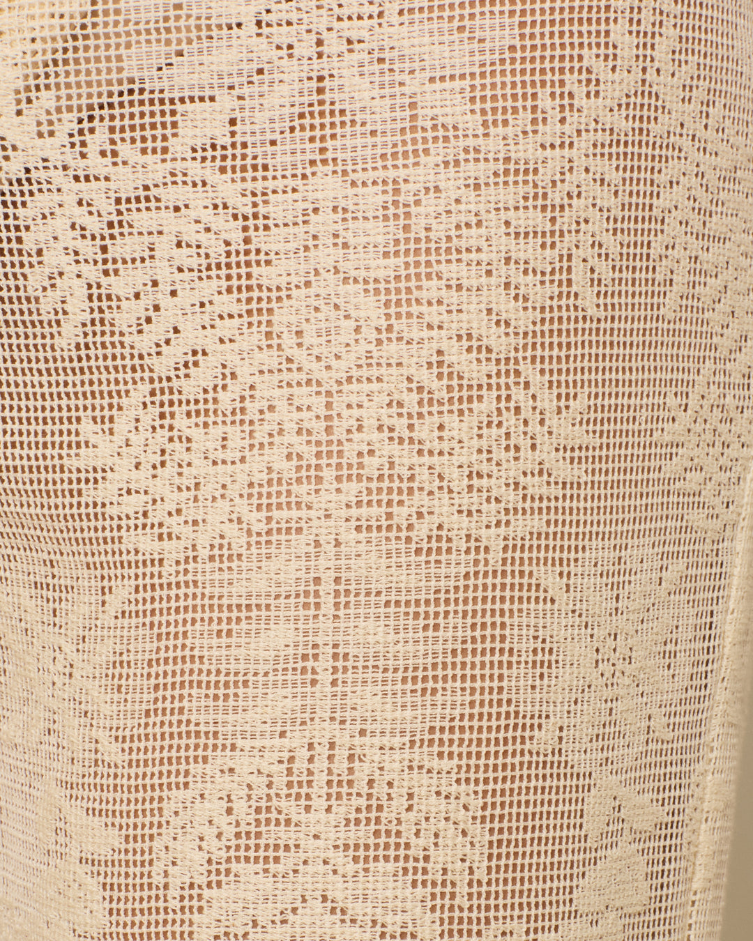 Close-up of the Bunny Pearl Lace Lattice Jean, featuring beige cotton lace with a botanical motif, intricate floral and geometric patterns, and delicate weaving.