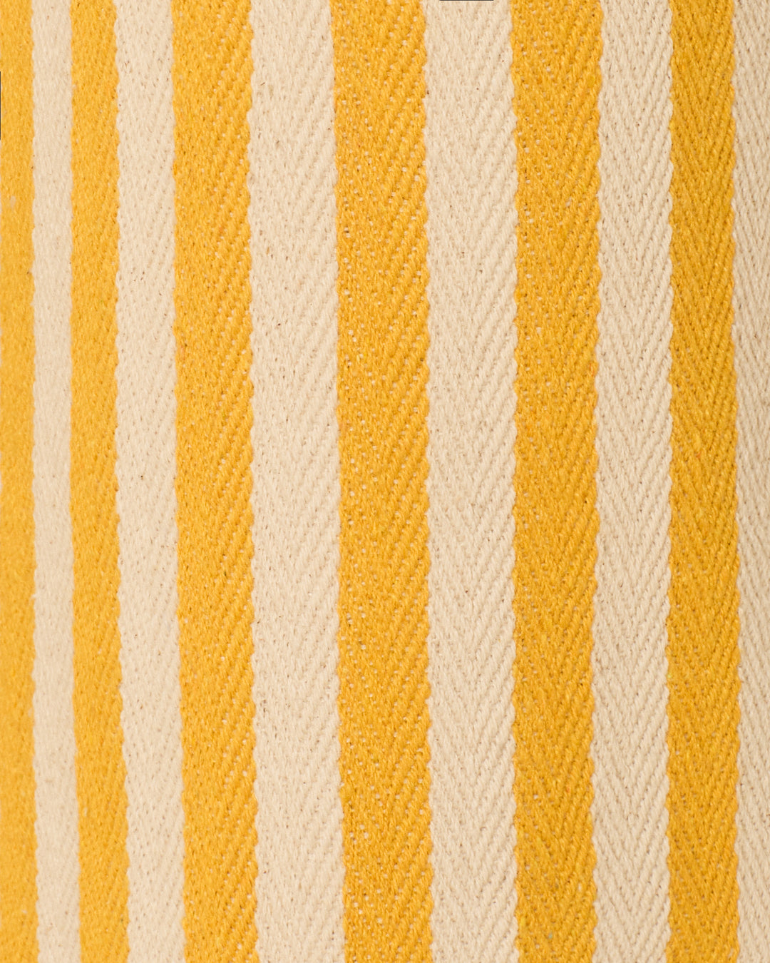 Close-up of the Charlie Sunlight Stripe Pants cotton twill fabric, featuring vertical yellow and off-white herringbone stripes—ideal for crafting stylish high-waisted pants.