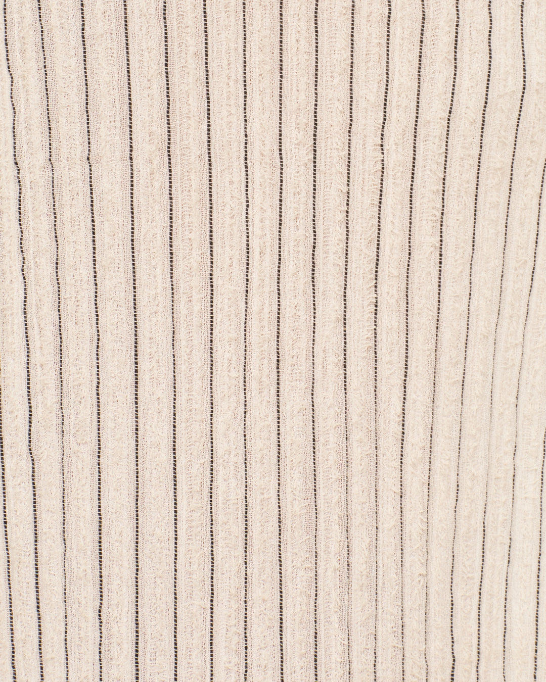 Close-up of the Diana Sea Salt Pants beige gauzy cotton, featuring evenly spaced vertical black stripes—ideal for a relaxed fit.