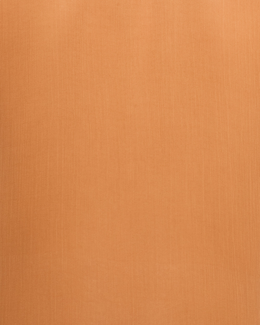 Close-up of the Elfie Fawn Chiffon Shirt’s plain, smooth orange-brown fabric surface featuring a subtle vertical weave pattern—its vintage-inspired cupro-chiffon texture is perfect for crafting an elegant sheer shirt.