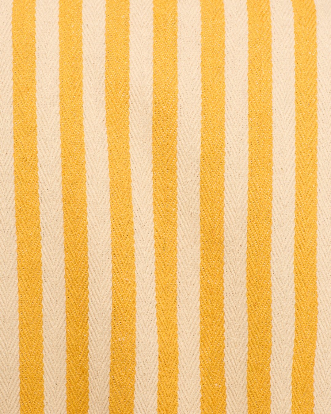 Close-up of the Evelyn Sunlight Stripe Jackets cotton twill fabric, featuring alternating vertical yellow awning stripes and off-white stripes with a subtle herringbone texture.