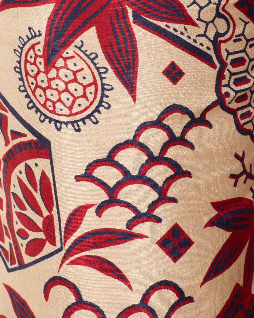 The Farah Crimson Hive Silk Pant showcases hand-loomed silk with a beige base and red-navy abstract patterns—leaves, scales, and geometric motifs—ideal for vintage wagara pants or bell-bottom flare silhouettes.