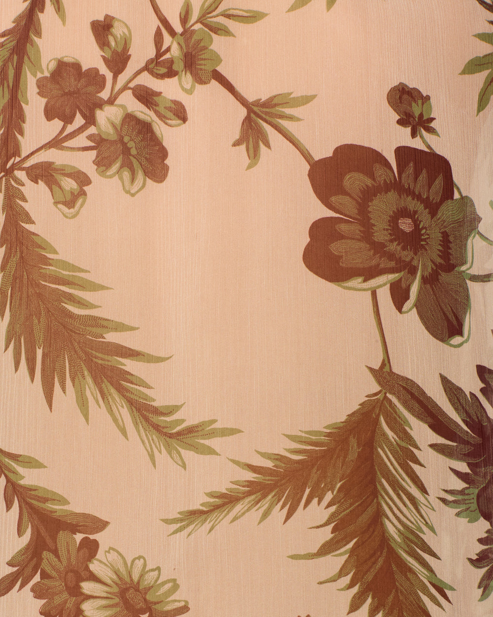Close-up of the Poet Summermoss Blouse fabric with a beige background, featuring a brown and green botanical motif of large flowers and leaves.