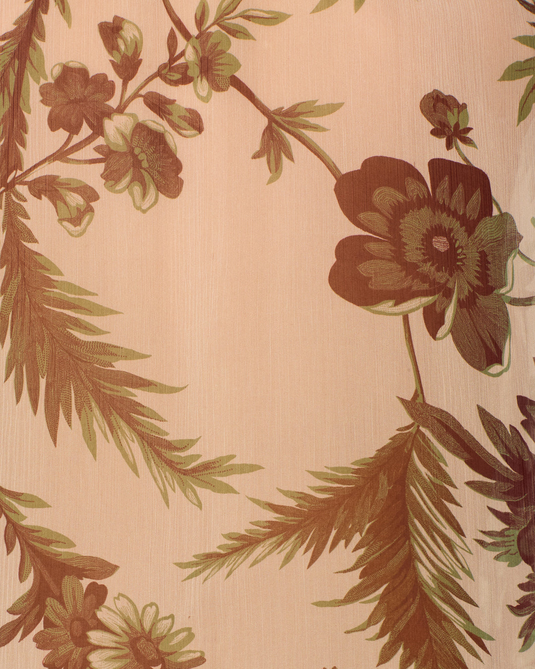 Close-up of the Poet Summermoss Blouse fabric with a beige background, featuring a brown and green botanical motif of large flowers and leaves.