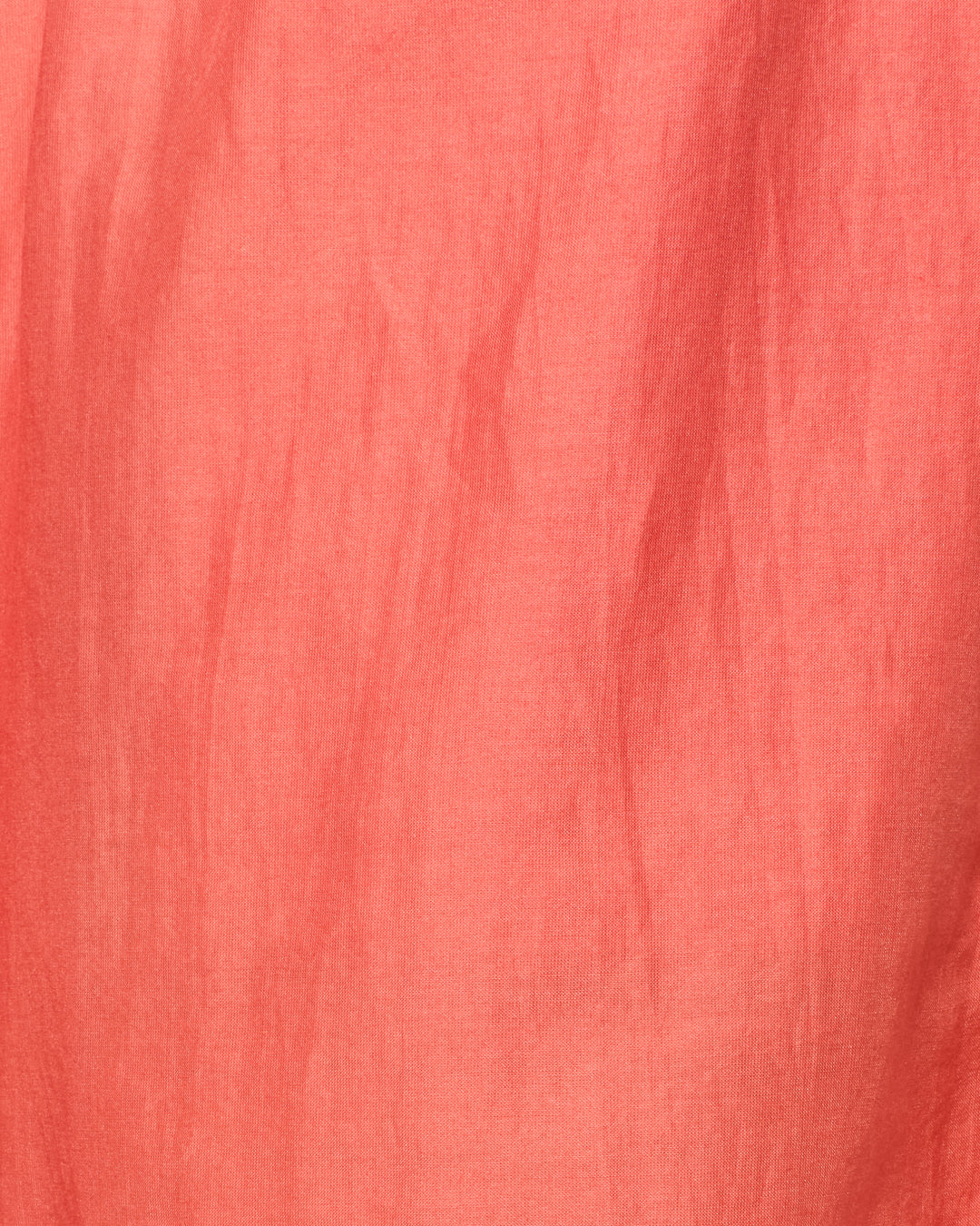 Close-up of Tillie Rouge Dust Short, made from a pink cotton-silk blend fabric with visible creases and a slightly textured surface.