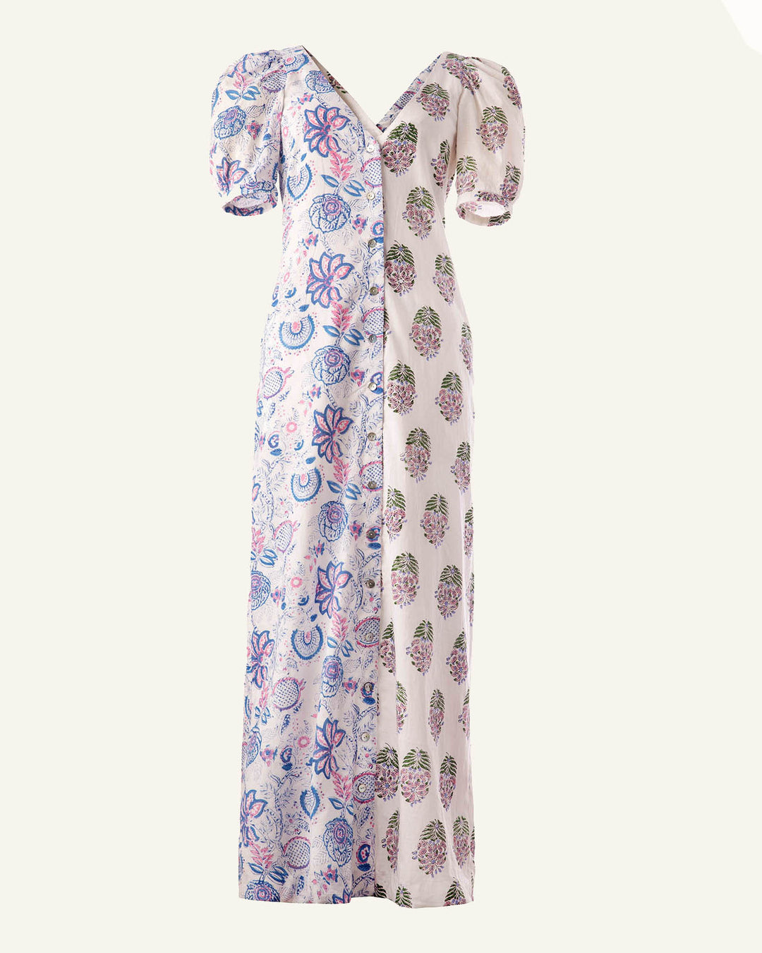 Introducing the Fifty Fifty Bloom Dress: This elegant long A-line dress features unique short puffed sleeves. One side is beautifully adorned with abstract blue and purple floral patterns, while the other side presents a striking contrast with a white backdrop, embellished with delicate hand block printed small multicolored floral designs.