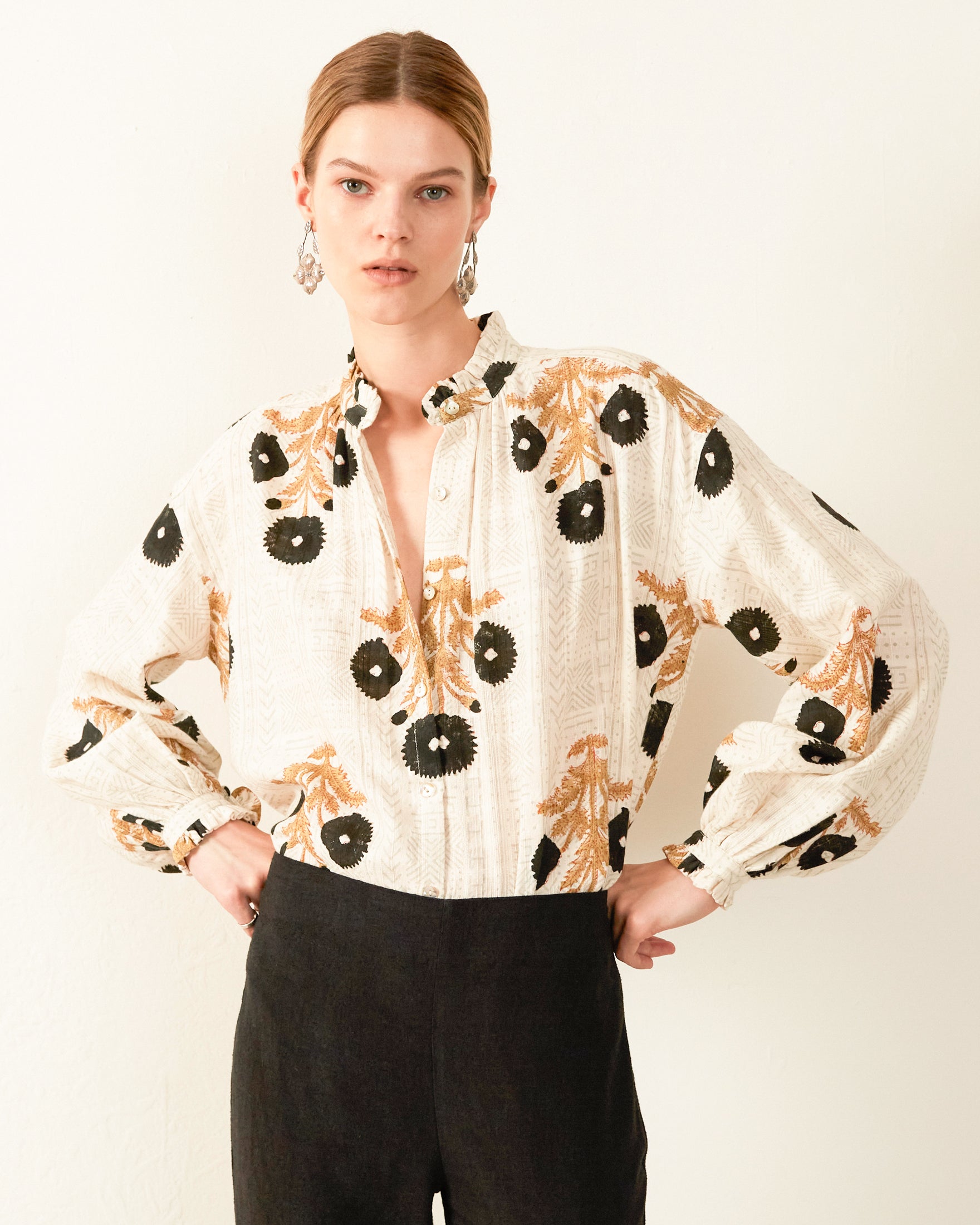 Blouse / shirt in good unusual hand printed pattern, flowered in black