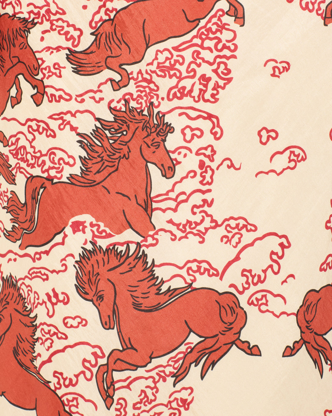 Red illustrated horses, inspired by mythical motifs, leap among swirling cloud patterns on a cream background in the Adelaide Rouge Pegasus Dress.