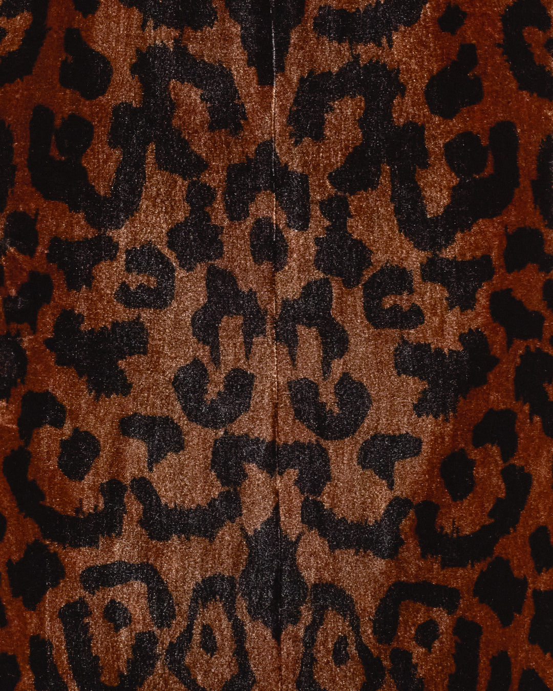 Close-up of the Afternoon Leopard Blazer, featuring a brown and black symmetrical leopard-print fabric with notched lapel detail.