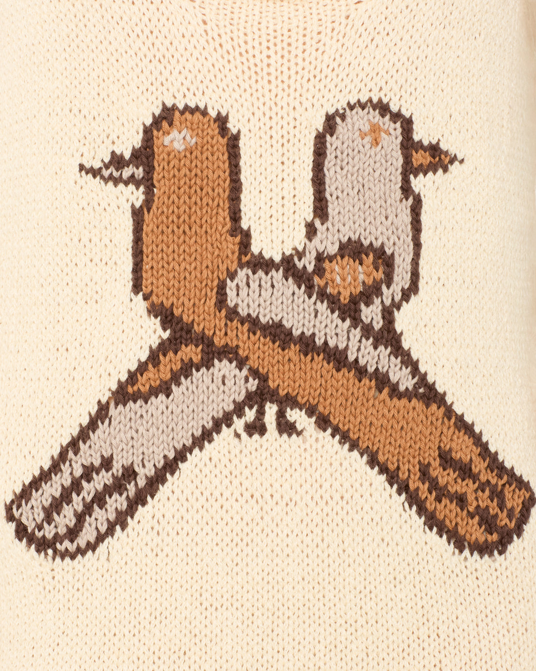 The Amery Lovebird Knit Dress features two stylized birds sitting back-to-back with crossed tails, inspired by a lovebird motif, on a cream-colored background.