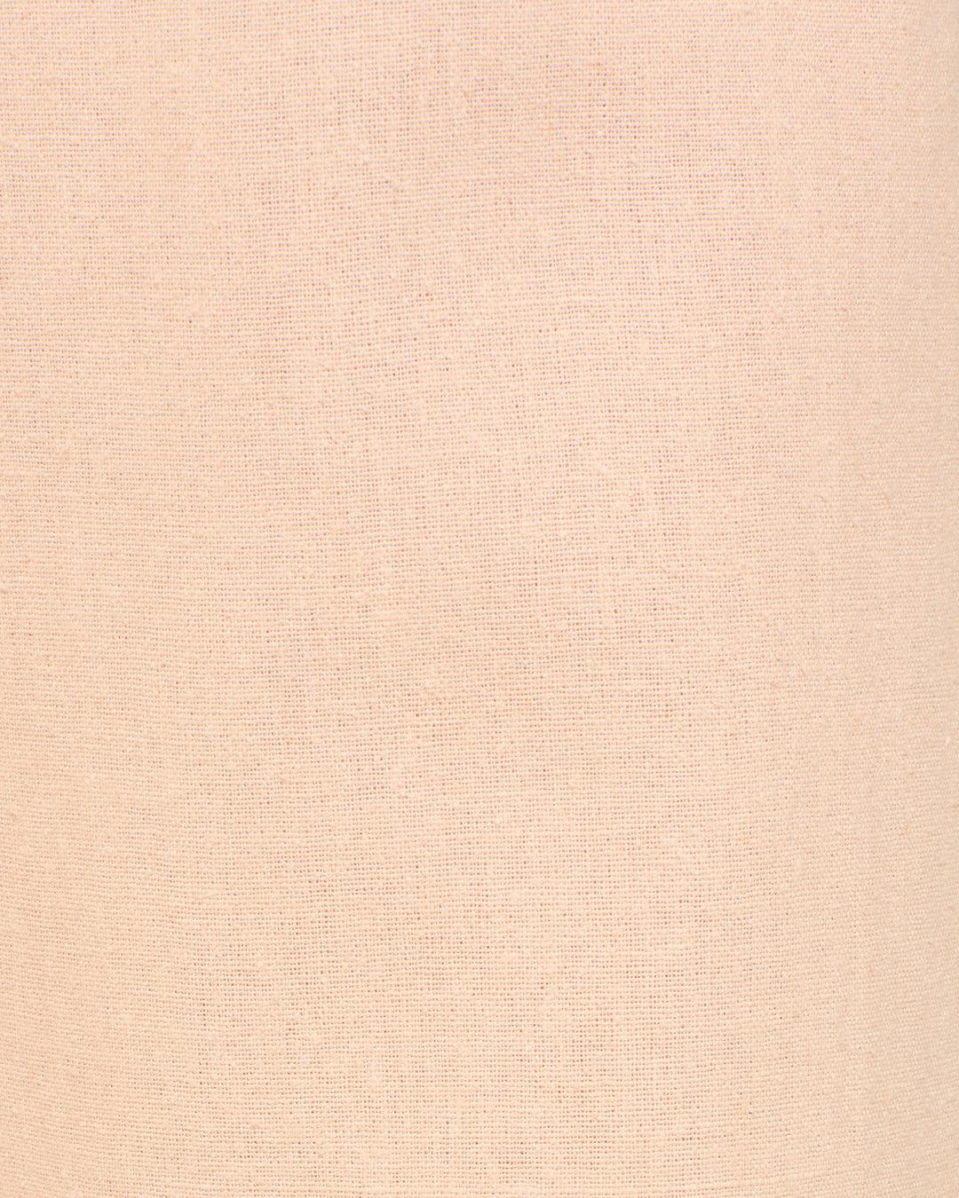 Close-up of Bunny Pink Blush Jean fabric in light beige, featuring a subtle woven texture and visible fibers—perfect for crafting sophisticated silk jean-cut pants.