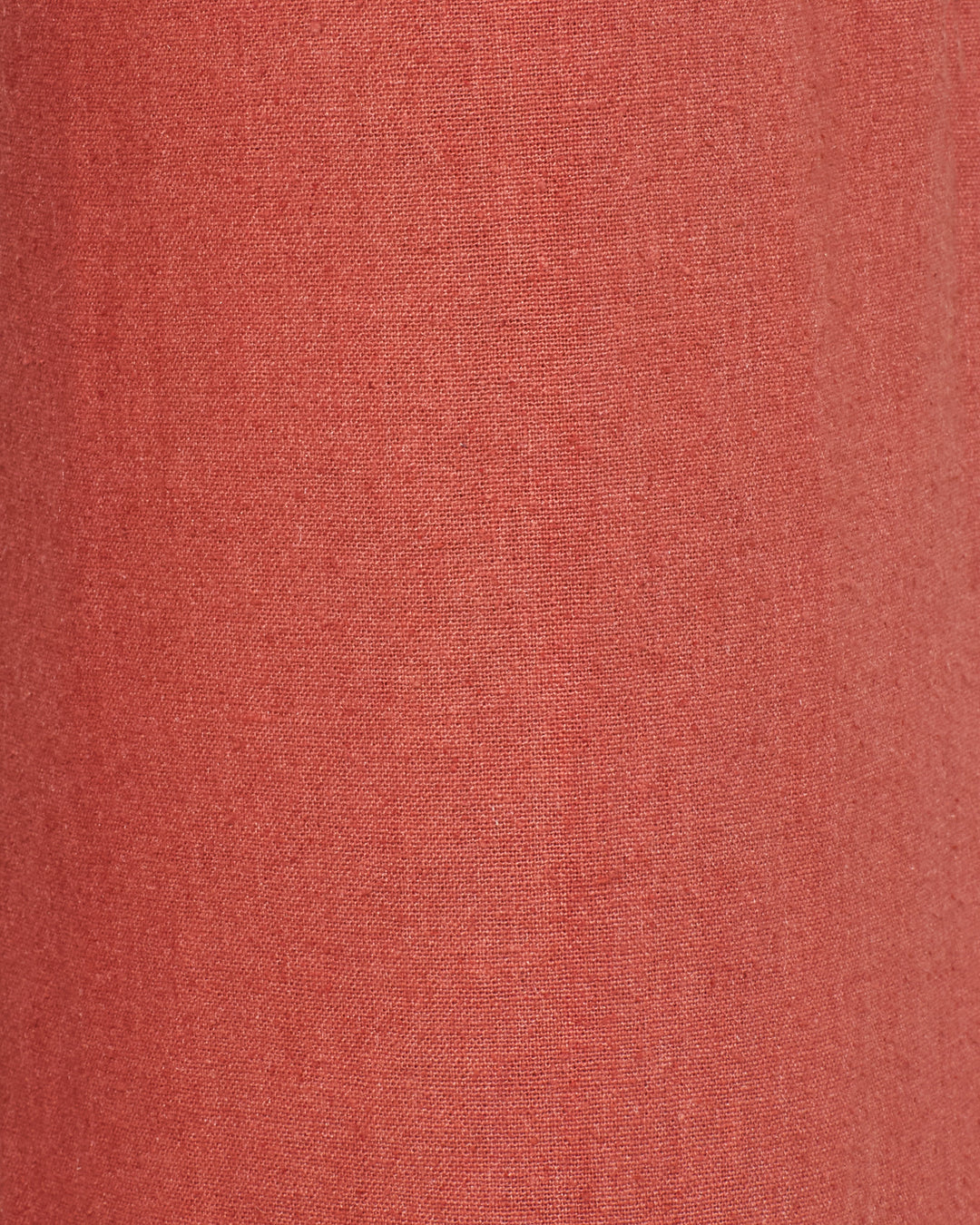Close-up of Charlie Red Ochre Silk Pant fabric, showing its plain, even texture and subtle weave—perfect for crafting elegant silk pants.