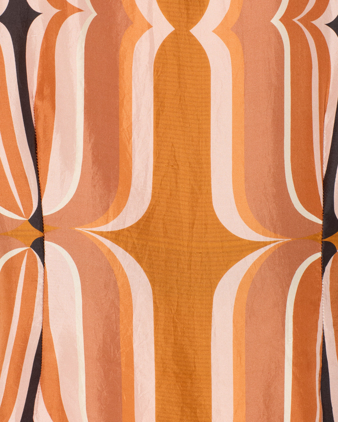 The Dana Mesa Verde Silk Shirt features a symmetrical, retro-inspired geometric pattern with curved lines in brown, beige, and peach on a textured silk fabric.